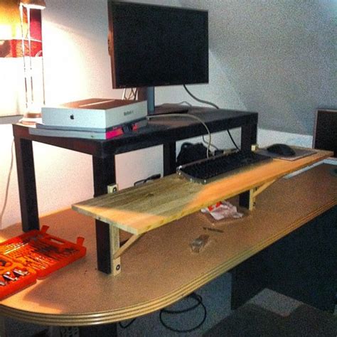 Standing desk hack a success. $20 in random bits and piece… | Flickr