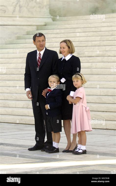 Chief Justice John G. Roberts poses with his family on the front steps of the Supreme Court ...