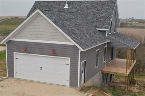 A carriage garage door and red barn lights - NewlyWoodwards