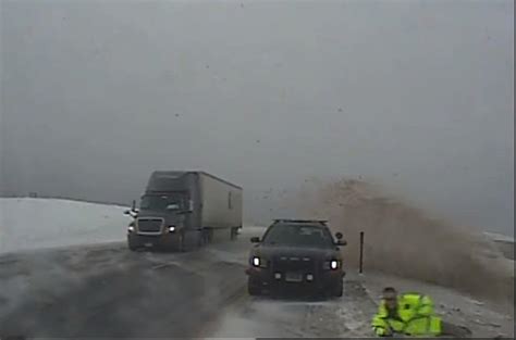 VIDEO: Wyoming Highway Patrol Trooper Almost Hit By Car Due To Winter ...