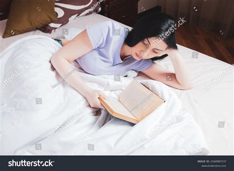 Young Girl Reading Book Bed Stock Photo 2160987237 | Shutterstock