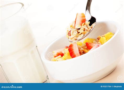 Muesli and milk stock photo. Image of yellow, spoon, cereal - 9321756