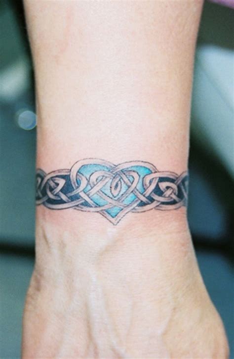 Celtic Wrist Band With Heart Tattoo | Celtic tattoo for women, Tribal wrist tattoos, Cool wrist ...