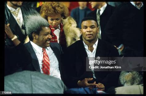 Mike Tyson Is Youngest Heavyweight Champion Photos and Premium High Res ...