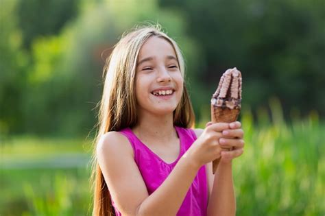 Free Photo | Smiling girl holding ice cream