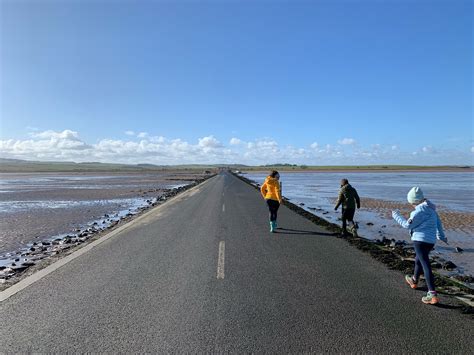 Have an adventure in Northumberland by walking across the causeway to ...