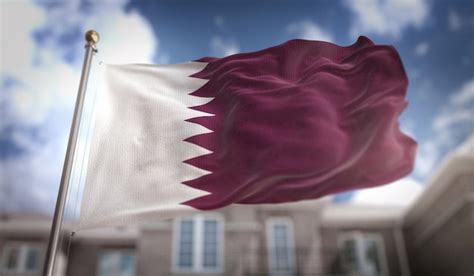 Premium Photo | Qatar flag 3d rendering on blue sky building background