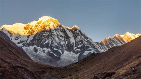 Annapurna South Mountain during Sunrise Golden Hour Being Hit by First Sunshine with Clear Sky ...