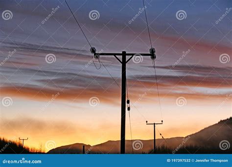 Power lines at sunset stock photo. Image of pylon, line - 197397532