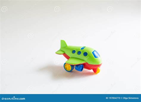 Toy Green Plastic Airplane with Colored Red, Blue, Yellow Details on a ...