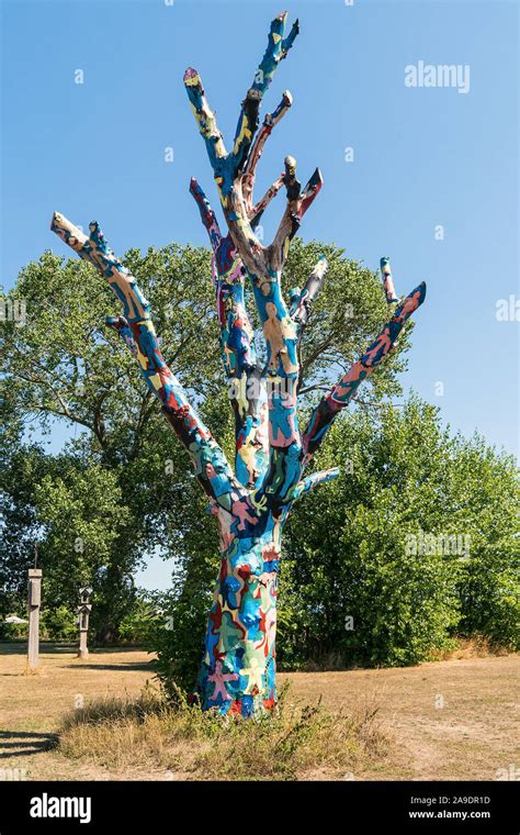 Bornholm, Nexø, art, colorful painted tree, sculpture landscape space Stock Photo - Alamy