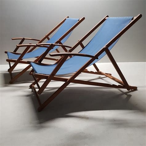 Pair wooden folding beach chairs with canvas upholstery | #92436