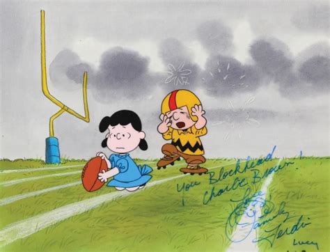 "Charlie Brown" and "Lucy" playing football production cels