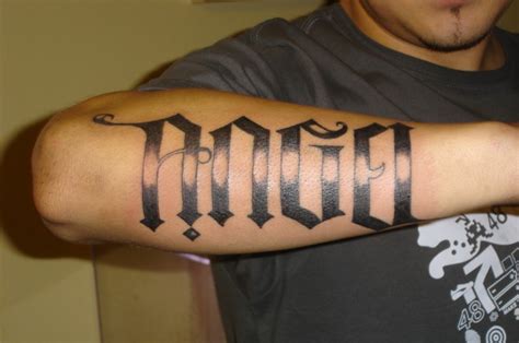 Huge-lettered angel word tattoo on forearm - Tattooimages.biz