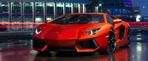 Download Red Lamborghini Urus with Luxury Interior | Wallpapers.com