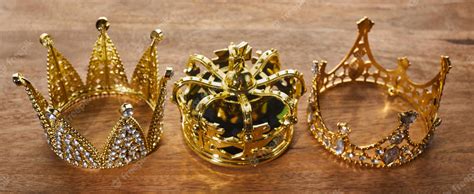 Premium Photo | Happy Epiphany day Three gold crowns on wooden background symbol of Tres Reyes ...