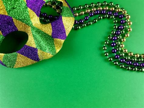 What Do Each Of The Mardi Gras Colors Mean? Here's Why You See So Much Green, Purple, And Gold