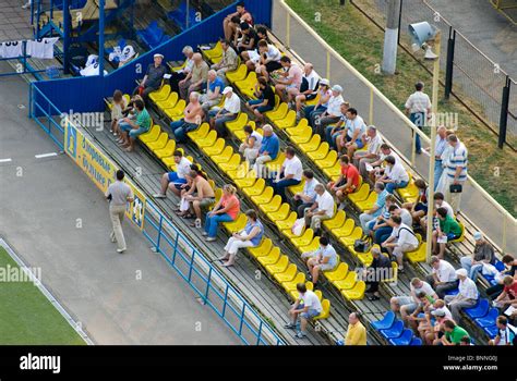 Tribune with football fans Stock Photo - Alamy