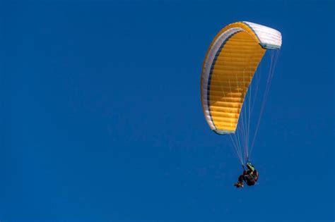 Premium Photo | Paragliding hang glider in the blue sky