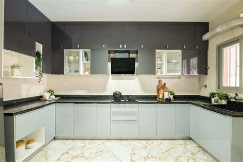 Modular U-Shaped Kitchen Design With A Black Granite Countertop | Livspace