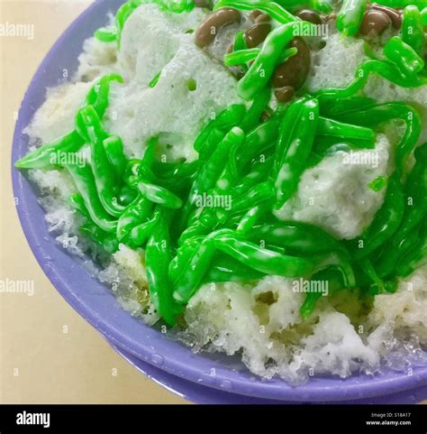 Singapore dessert, Chendol - shaved ice served with green jelly, red beans, palm sugar and ...