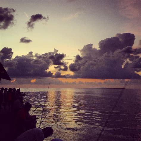 Fishing off the Pier at Sunset Photograph by Cameron Kinsey | Fine Art ...