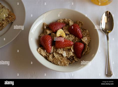 A bowl of cereal with fruit Stock Photo - Alamy