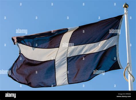 St Piran's flag, the flag of Cornwall flies from this flagpole in centre of Perranporth, a ...