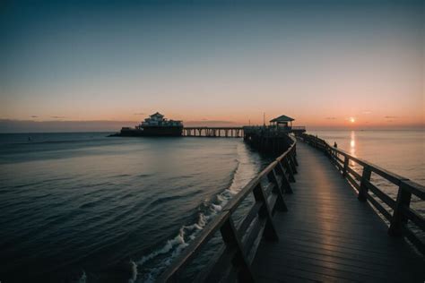 Premium AI Image | Detail of a seaside boardwalk at sunset