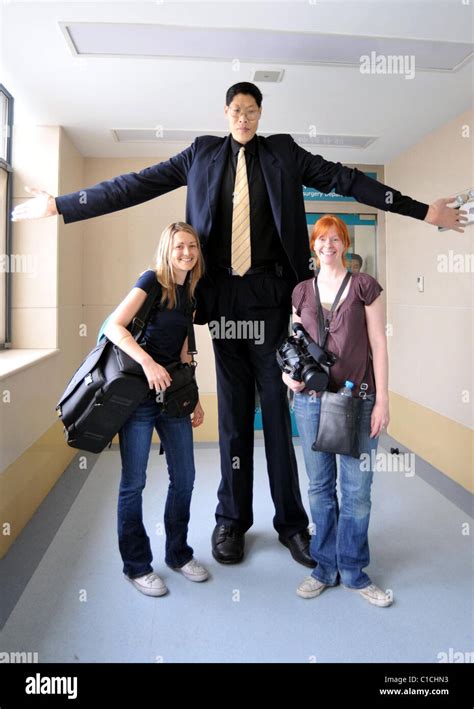 The world's tallest person, Zhang Juncai, (who stands at 7ft 9ins Stock ...