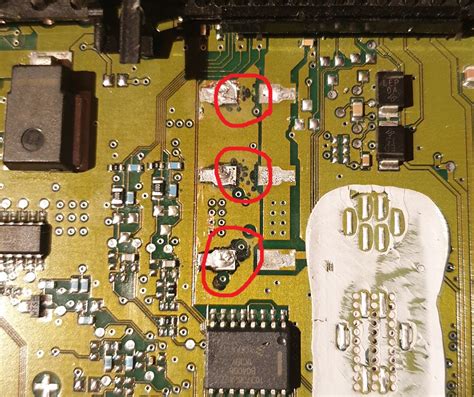 repair - Found some SMD capacitor leakage, can I sand them to clean the PCB? - Electrical ...