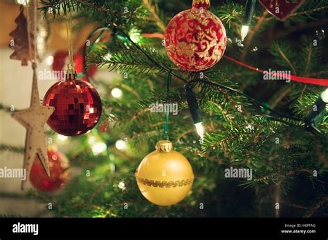 Christmas tree decorations with baubles Stock Photo - Alamy