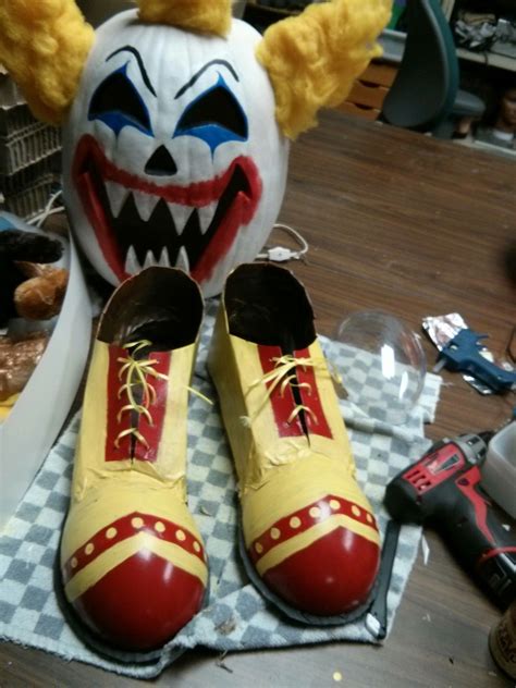 Clown shoes made from cardboard, a large plastic easter egg and ribbon. Looked great peeking out ...