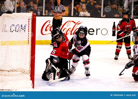 Kids playing hockey editorial photo. Image of jersey - 18656366