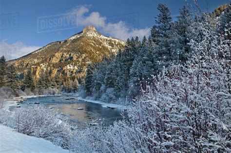 The Gallatin River in winter with Storm Castle Mountain in the Gallatin ...