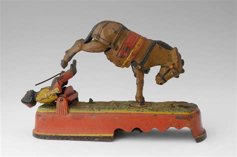 Lot 1251: "ALWAYS DID 'SPISE A MULE" MECHANICAL BANK: Cast iron mechanical bank by J.E. Stevens ...