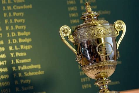 The men's trophy in front of a list of former Wimbledon champions. Matthias Hangst/AELTC ...