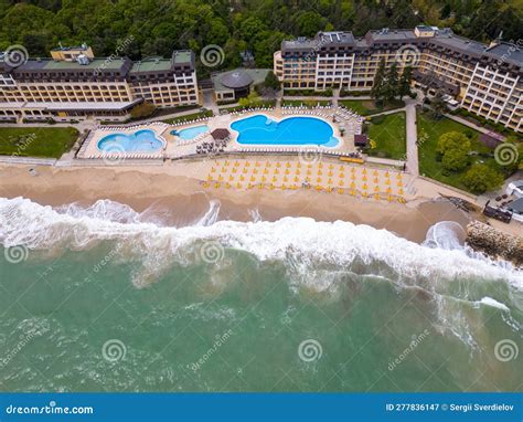 Aerial View of a Luxurious Hotel with a Seafront Pool, Ready To Welcome Guests at the Beginning ...