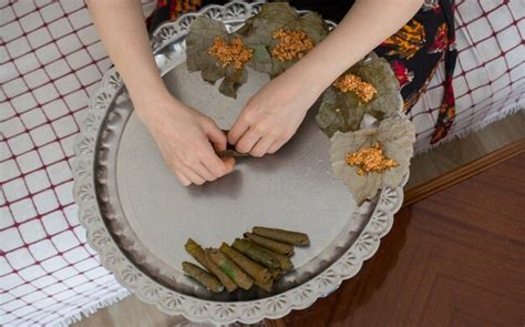 Premium Photo | Preparing stuffed vine leaves with rice and meat or traditional sarma