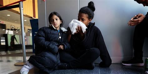 Migrants Sleep in Police Stations, Vacant Schools as Title 42 Ends - WSJ