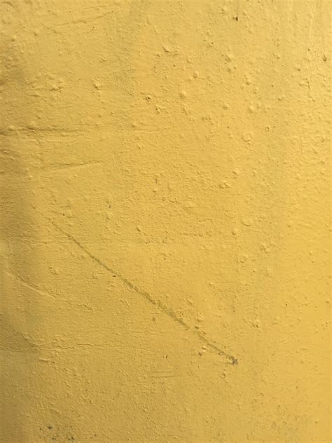 Bright yellow wall with lots of texture | Free Textures