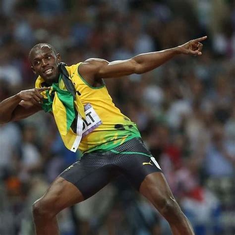 Download Usain Bolt Does His Iconic Pose Wallpaper | Wallpapers.com