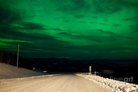 Northern Lights night sky over rural winter road Photograph by Stephan ...