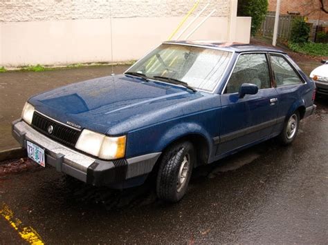 OLD PARKED CARS.: 1986 Mercury Lynx GS Hatchback.