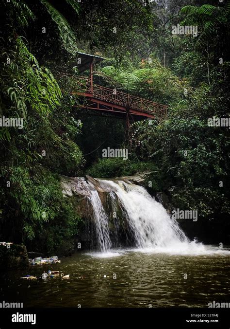 Parit Waterfall, a popular picnic location for locals and tourists, with plastic rubbish washed ...