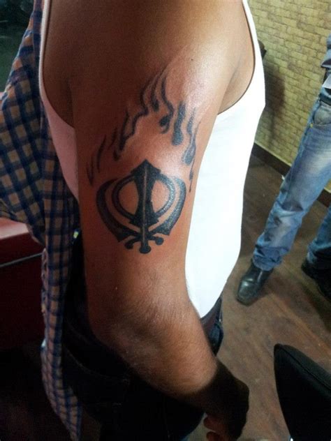 Tattoos Designs, Pictures And Ideas: Flaming Khanda Tattoo On Bicep