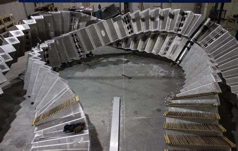 5 tons of vintage wooden escalator warped into spectacular subway sculpture