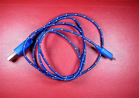 USB Cable in Blue Braid with White Dots on Red Background. Stock Photo ...