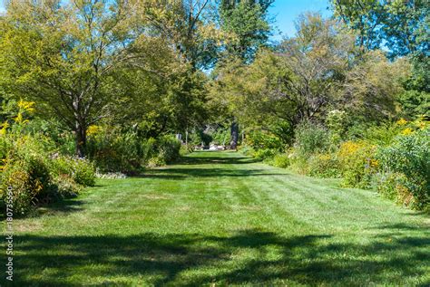 Garden path area. Open botanical garden path on grass. Grass and nature ...