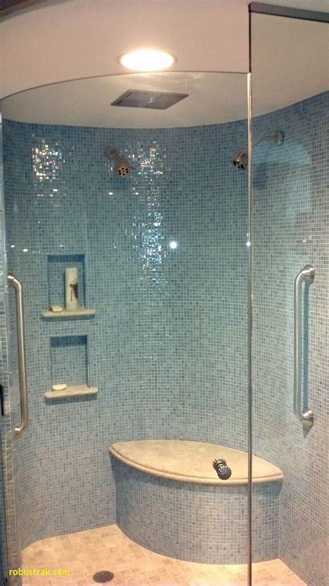 iridescent blue glass tile shimmers on curved shower walls | Glass tile bathroom, Iridescent ...